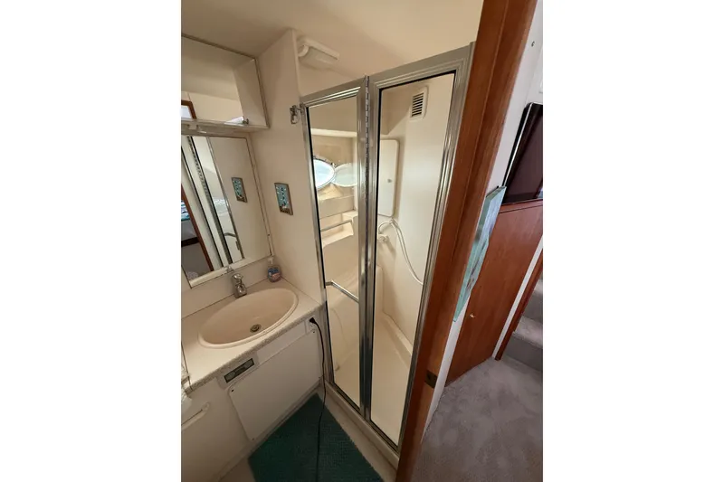 Slide: The Image of Bathroom interior of 1998 Silverton 372 Motor Yacht with shower and sink. - 12
