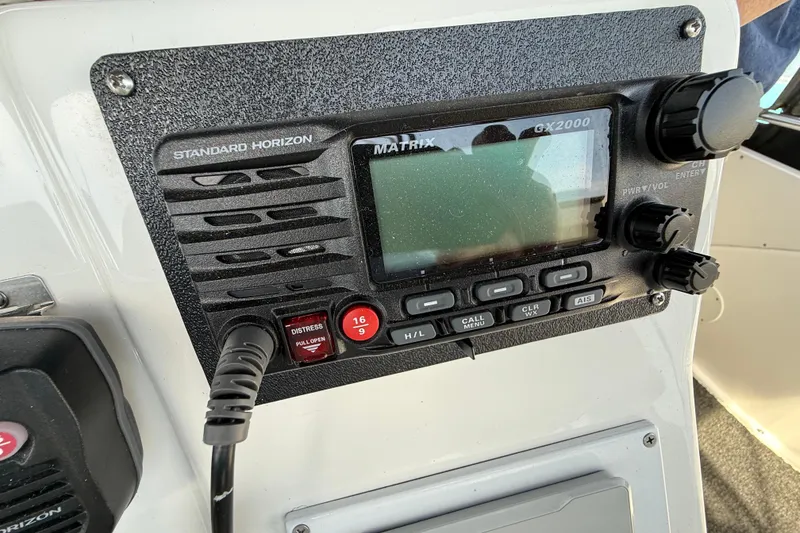Slide: The Image of Control panel of a 1998 Silverton 372 Motor Yacht featuring a Standard Horizon GX2000 radio. - 15
