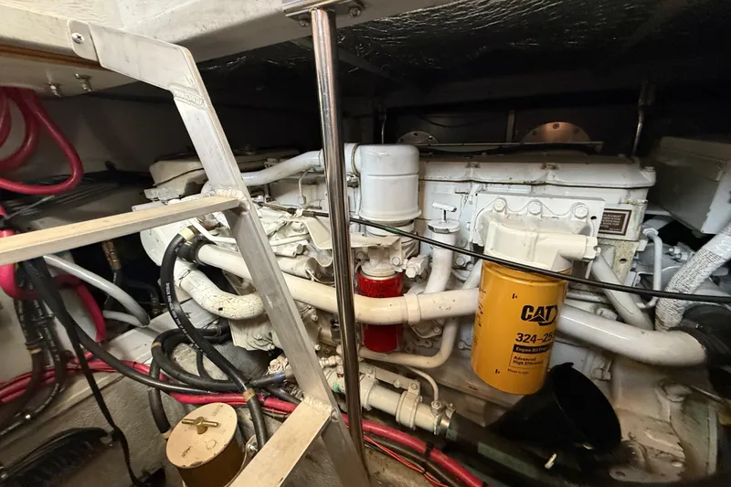 Slide: The Image of Engine room of a 1998 Silverton 372 Motor Yacht with visible CAT engine components. - 19