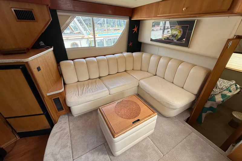 Slide: The Image of Luxurious interior of a 1998 Silverton 372 Motor Yacht with cream leather seating. - 6