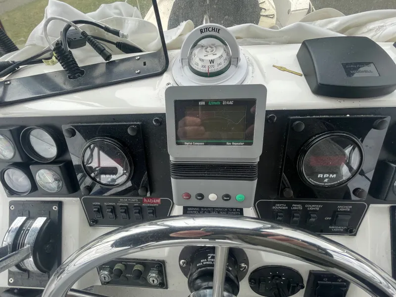 Slide: The Image of Dashboard of a 1992 Bayliner 38 Motoryacht with navigation instruments. - 10