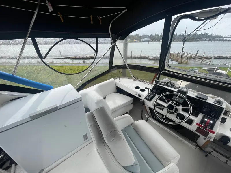 Slide: The Image of Interior of 1992 Bayliner 38 Motoryacht by the water. - 11
