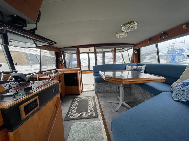 Slide: The Image of Interior of a 1992 Bayliner 38 Motoryacht with blue seating. - 17