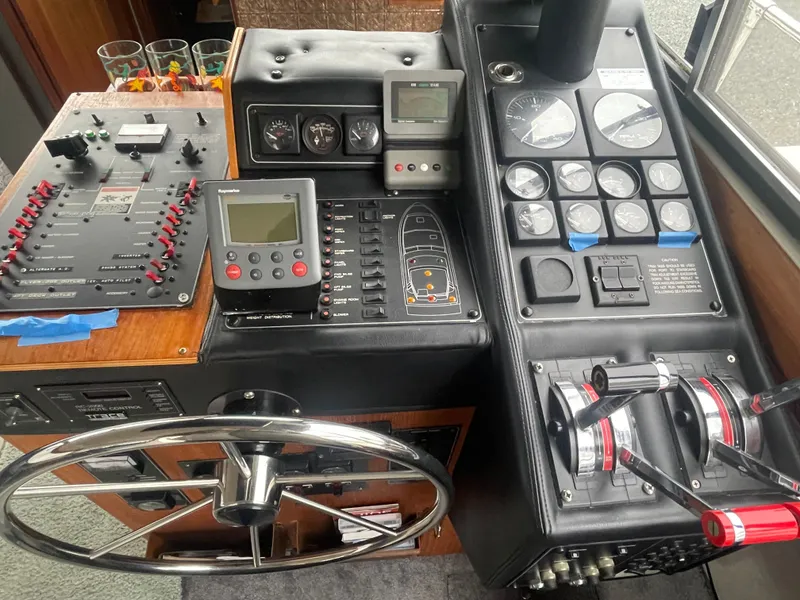 Slide: The Image of 1992 Bayliner 38 Motoryacht cockpit with controls and instruments. - 19