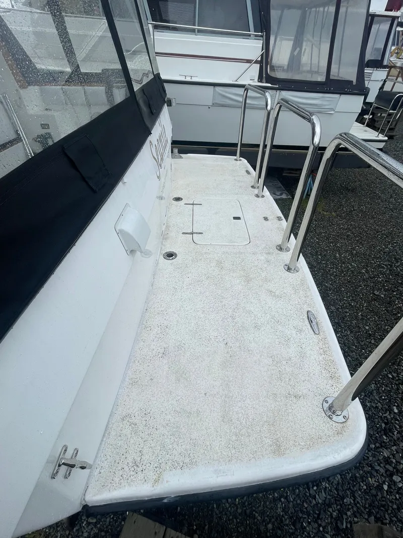 Slide: The Image of 1992 Bayliner 38 Motoryacht with spacious deck and stainless steel railing. - 2