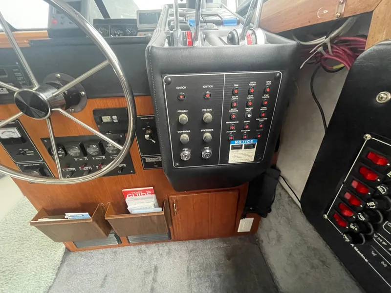 Slide: The Image of 1992 Bayliner 38 Motoryacht helm with controls and gauges. - 20