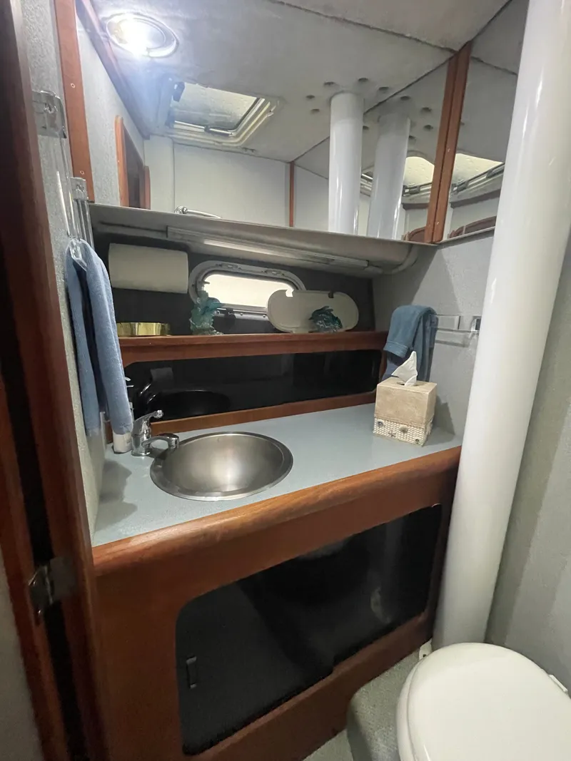 Slide: The Image of 1992 Bayliner 38 Motoryacht bathroom with sink and toilet. - 33