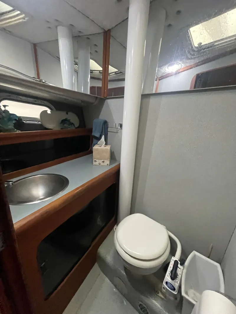 Slide: The Image of 1992 Bayliner 38 Motoryacht bathroom with sink and toilet. - 34