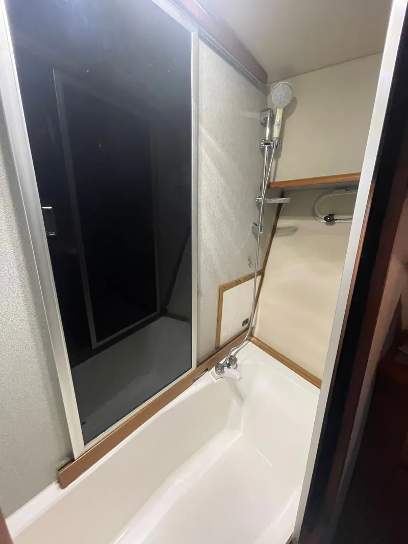 Slide: The Image of 1992 Bayliner 38 Motoryacht bathroom with shower. - 35