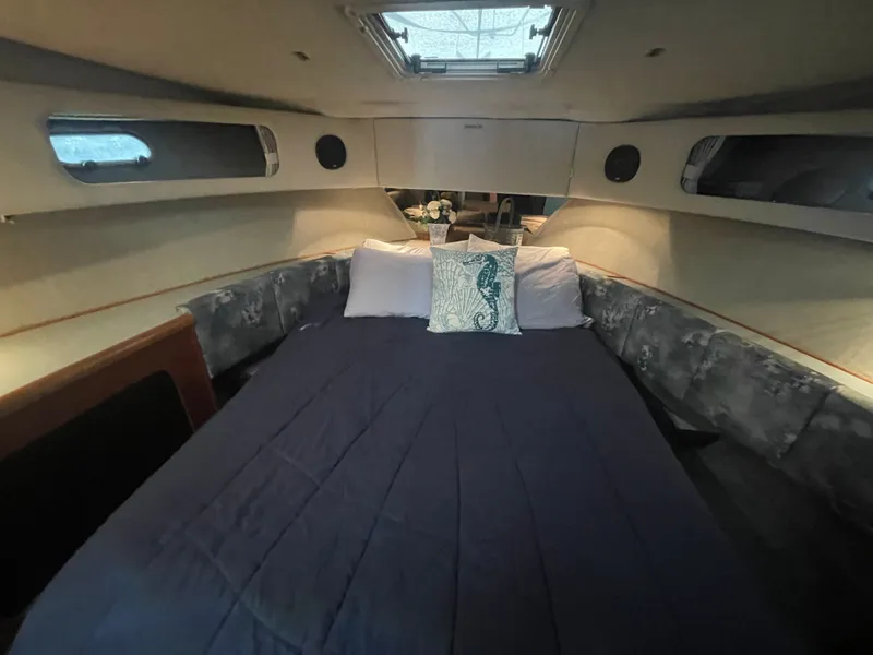 Slide: The Image of Interior of 1992 Bayliner 38 Motoryacht featuring cozy bedroom. - 36
