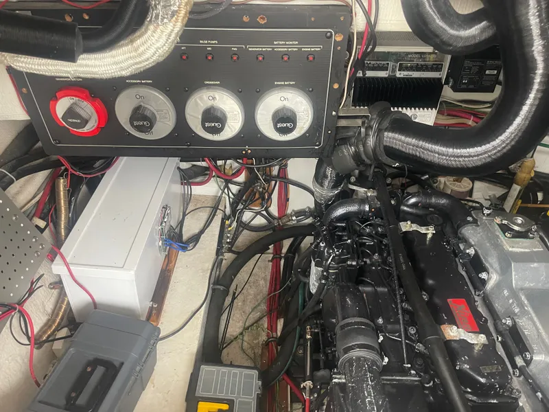 Slide: The Image of 1992 Bayliner 38 Motoryacht engine room with control panel. - 39