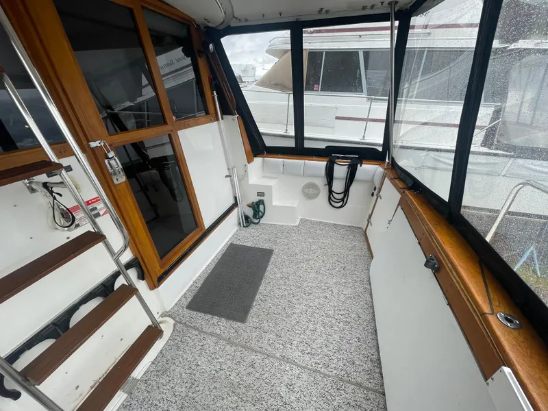 Slide: The Image of Interior of a 1992 Bayliner 38 Motoryacht with wood accents. - 4