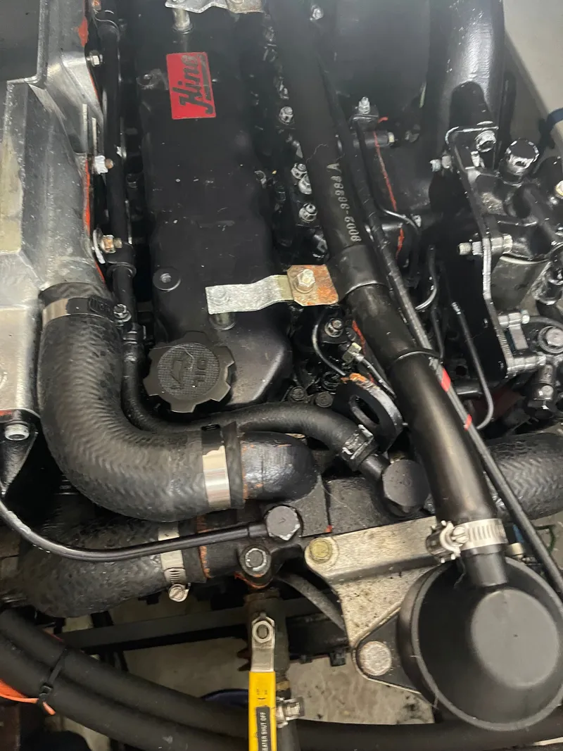 Slide: The Image of Engine compartment of a 1992 Bayliner 38 Motoryacht with detailed components. - 45