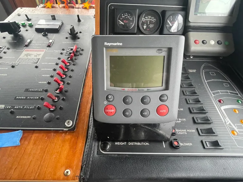 Slide: The Image of Bayliner 38 Motoryacht 1992 control panel with Raymarine autopilot. - 49