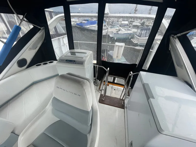 Slide: The Image of Interior of a 1992 Bayliner 38 Motoryacht with seating and helm station. - 6