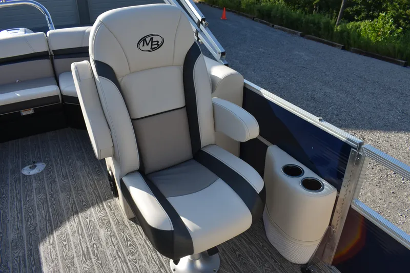 Slide: The Image of Luxurious seating on 2026 Montego Bay 8522 BR DLX boat with cup holders. - 12