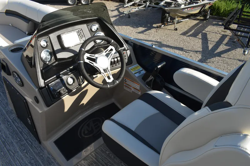 Slide: The Image of 2026 Montego Bay 8522 BR DLX boat interior with steering wheel and control panel. - 13