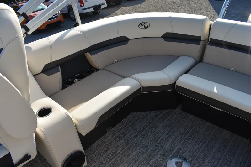 Slide: The Image of Luxurious seating on 2026 Montego Bay 8522 BR DLX pontoon boat with cup holders and stylish design. - 22