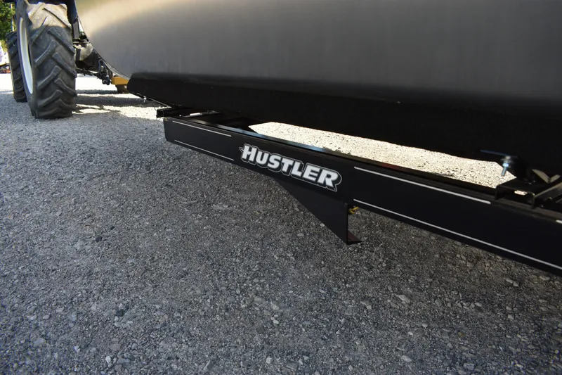 Slide: The Image of Underneath view of a 2026 Montego Bay 8522 BR DLX with Hustler trailer attachment. - 24