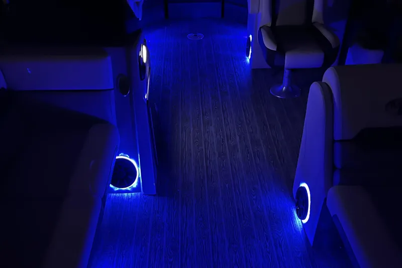 Slide: The Image of Interior of 2026 Montego Bay 8522 BR DLX boat with ambient blue LED lighting. - 9