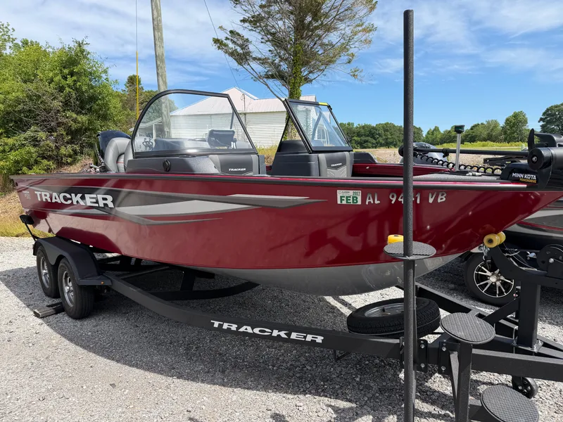 The Image of Red 2025 Tracker Targa 18 boat on trailer. - 1