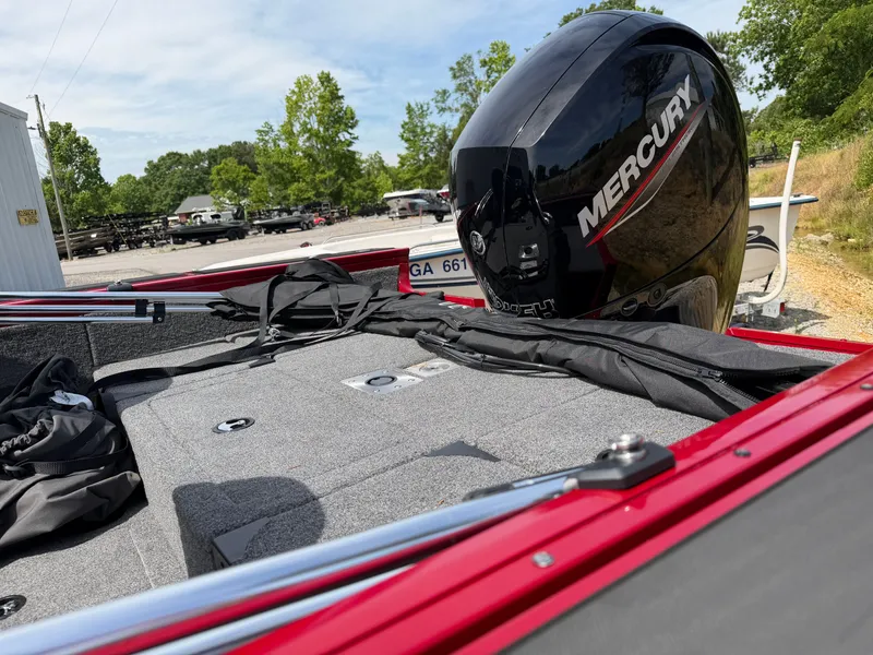 Slide: The Image of Tracker Targa 18 boat 2025 with Mercury engine outdoors. - 14