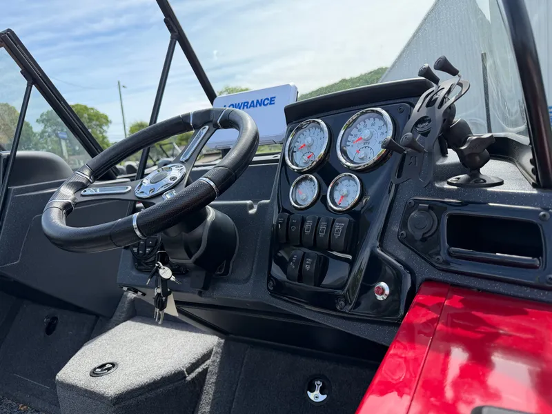 Slide: The Image of Interior view of 2025 Tracker Targa 18 boat with dashboard and steering wheel. - 6