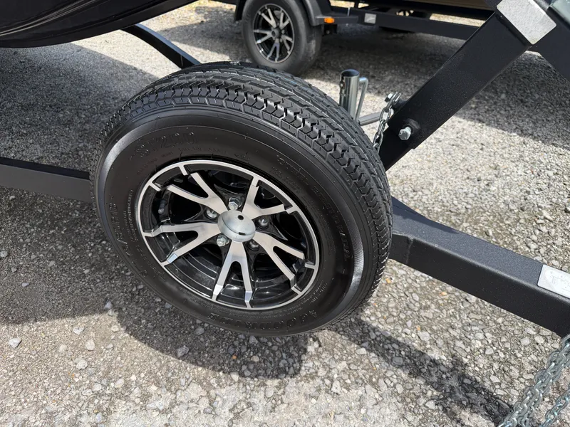 Slide: The Image of 2024 G3 Sportsman 1810sc trailer tire on gravel surface. - 19
