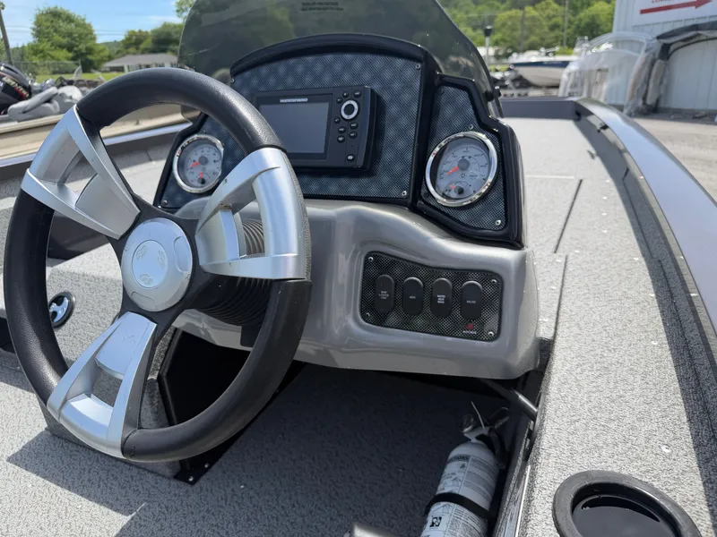 Slide: The Image of 2024 G3 Sportsman 1810sc boat dashboard with steering wheel and gauges. - 7