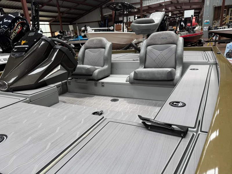Slide: The Image of Interior of 2024 Avid 18XC with gray seats and modern design. - 10