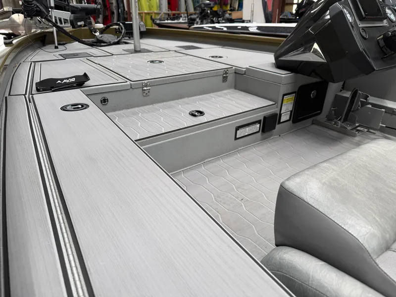 Slide: The Image of Interior of a 2024 Avid 18XC boat with gray design. - 11