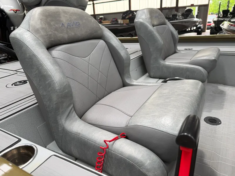 Slide: The Image of 2024 Avid 18XC boat seats with gray leather design. - 16