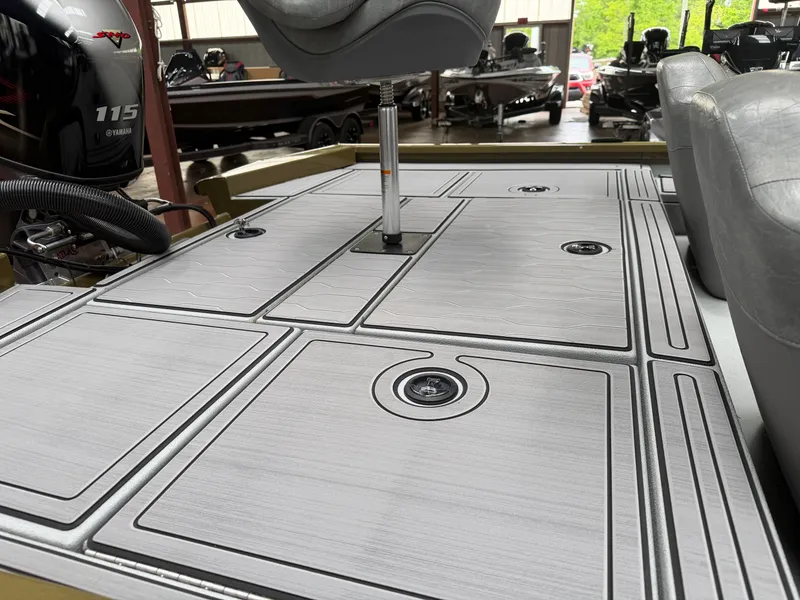 Slide: The Image of 2024 Avid 18XC boat deck with gray design and seat. - 17