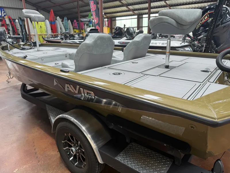 Slide: The Image of 2024 Avid 18XC boat in a warehouse with accessories. - 3