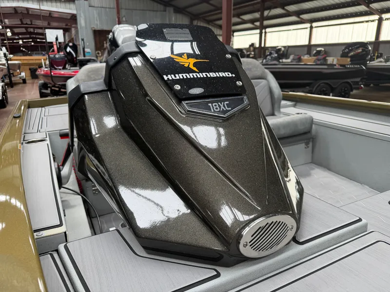 Slide: The Image of Avid 18XC 2024 boat featuring Humminbird technology in warehouse. - 4