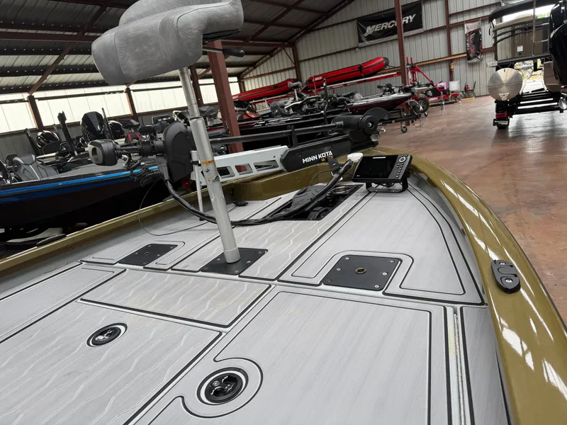 Slide: The Image of 2024 Avid 18XC boat with Minn Kota motor in warehouse. - 5