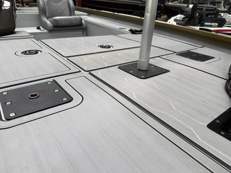 Slide: The Image of Interior of Avid 18XC boat, 2024 model, featuring gray deck. - 7