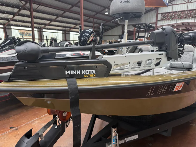 Slide: The Image of 2024 Avid 18XC boat with Minn Kota Ultrex motor in warehouse. - 8