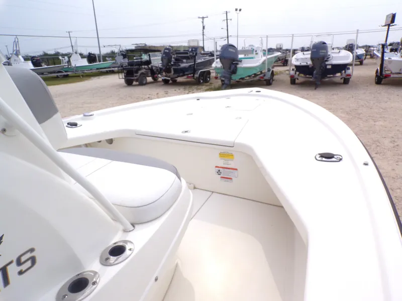 Slide: The Image of 2022 Mako 18 LTS boat in a lot with other boats. - 24