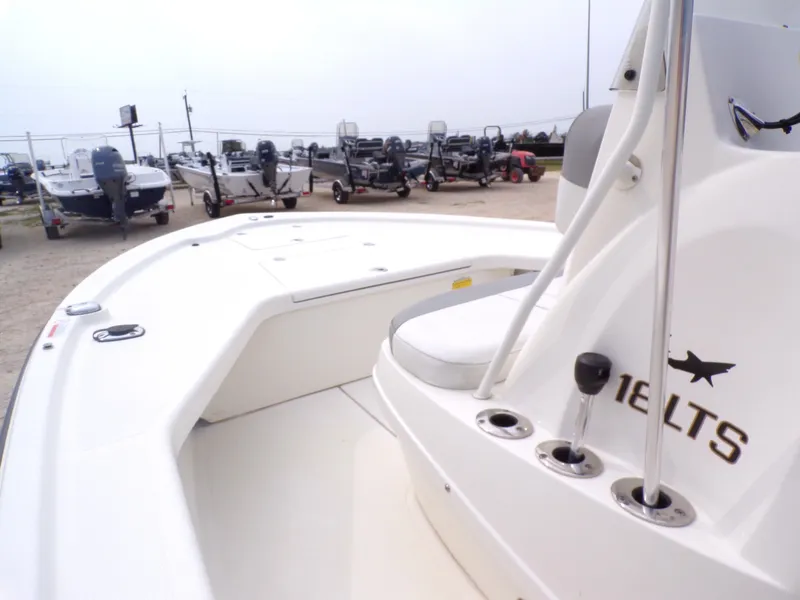 Slide: The Image of 2022 Mako 18 LTS boat in a lot with other boats. - 25