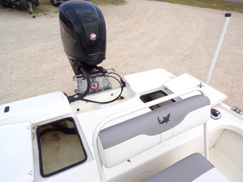 Slide: The Image of 2022 Mako 18 LTS boat with outboard motor and seating area. - 32