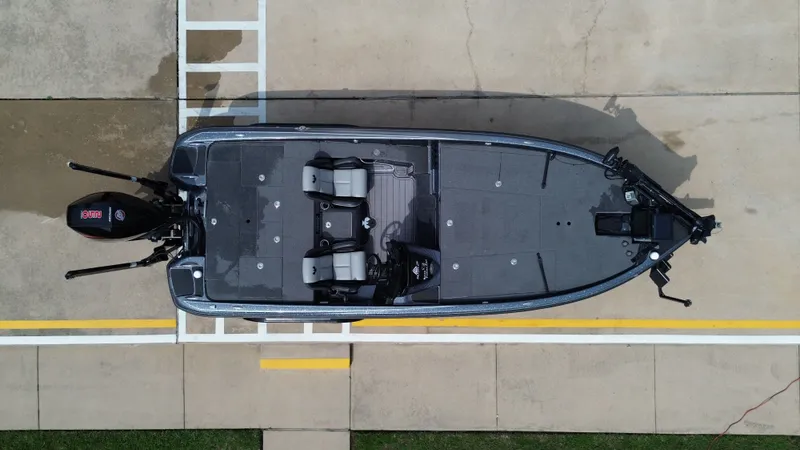 Slide: The Image of Aerial view of a 2021 Phoenix 921 Elite boat on concrete. - 29