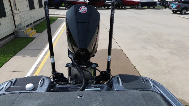 Slide: The Image of Rear view of a 2021 Phoenix 921 Elite boat on a parking lot. - 33