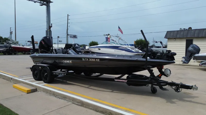Slide: The Image of 2021 Phoenix 921 Elite boat on trailer in a parking lot. - 5