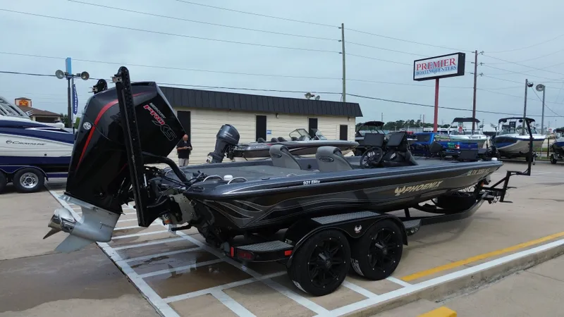 Slide: The Image of 2021 Phoenix 921 Elite boat parked at Premier Boat Center. - 7