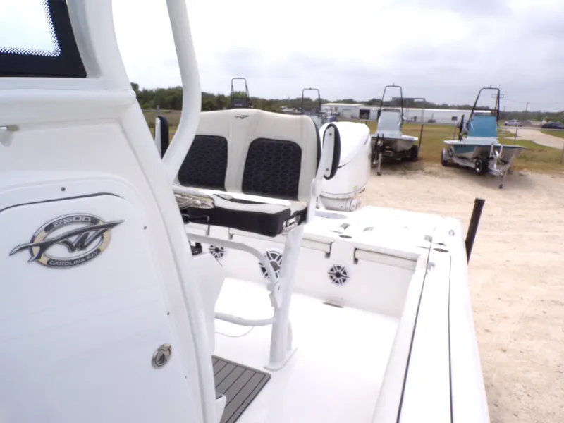 Slide: The Image of 2026 Tidewater 2500 Carolina Bay boat in a parking area. - 35