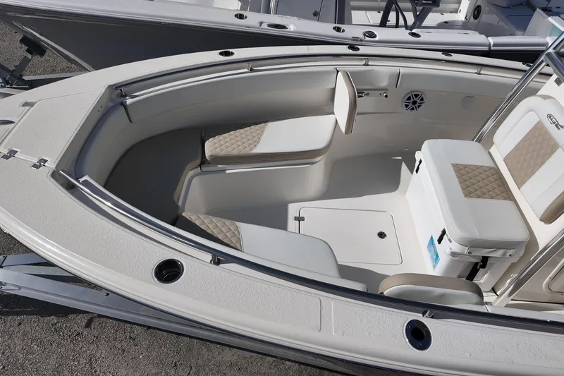 Slide: The Image of 2026 Bulls Bay 255 Center Console boat interior with cushioned seating and storage. - 14