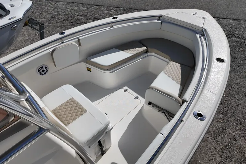 Slide: The Image of 2026 Bulls Bay 255 Center Console boat interior with cushioned seating and stainless steel railings. - 4
