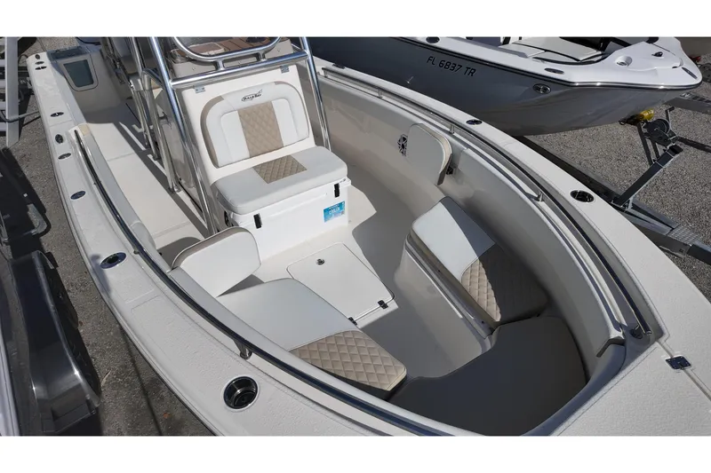 Slide: The Image of 2026 Bulls Bay 255 Center Console boat interior with cushioned seating and storage compartments. - 5