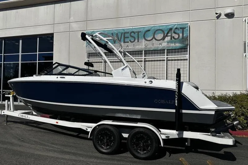 Slide: The Image of 2025 Cobalt CS23 boat on trailer at West Coast Boat Center. - 2